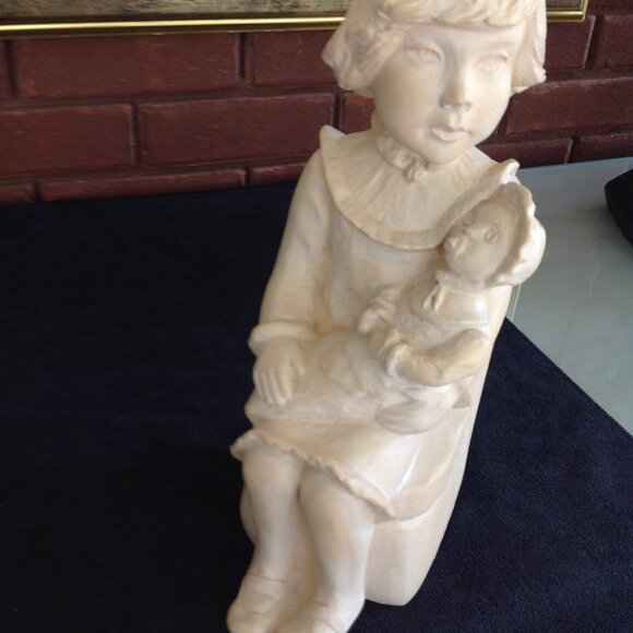Adorable Clay Sculpture of a Child Holding her Doll - Picture 3 of 4